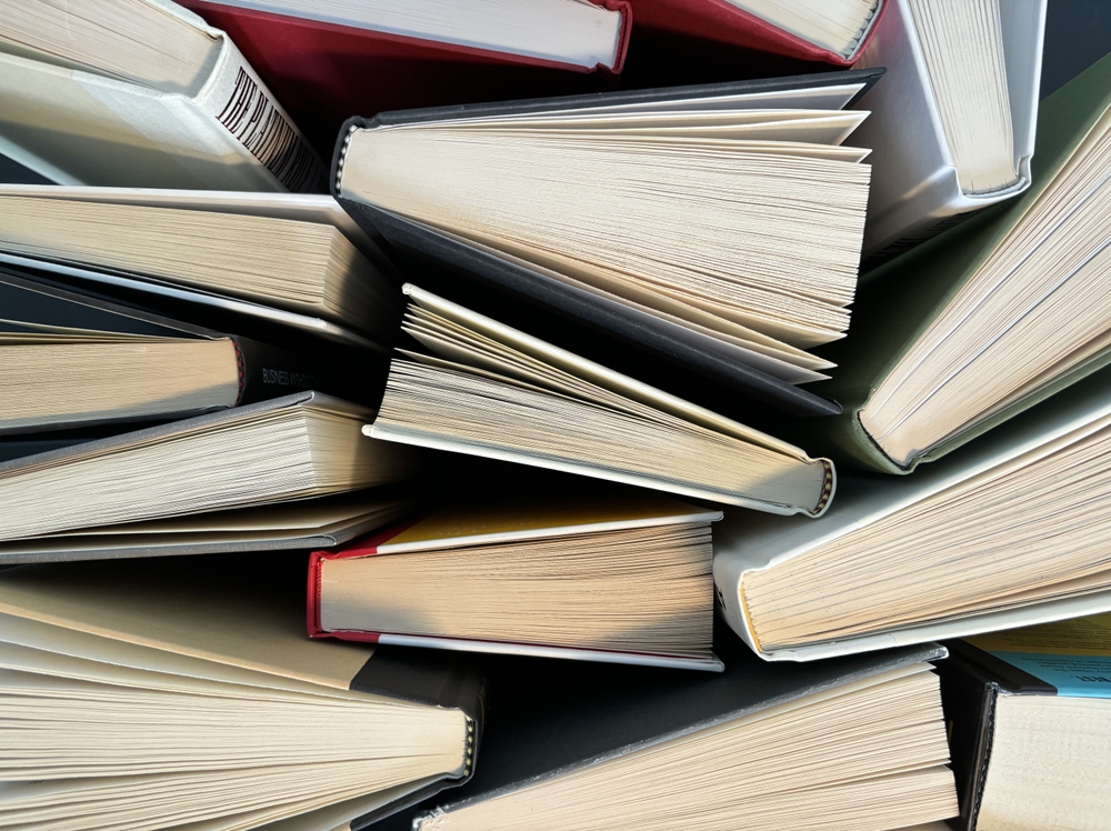 A,chaotic,yet,charming,collection,of,stacked,books