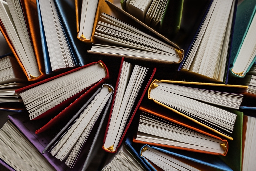 Books,opened,on,the,side,on,the,table,top,view.