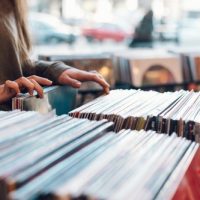 Close,up,of,a,woman,hands,choosing,vinyl,record,in